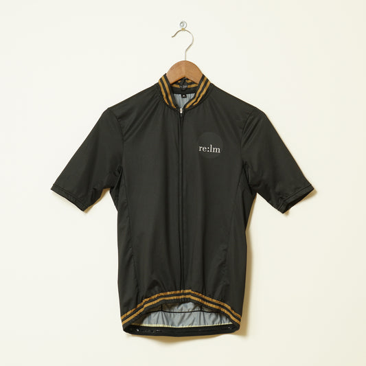 Front of men's Relm Cycling jersey in varsity