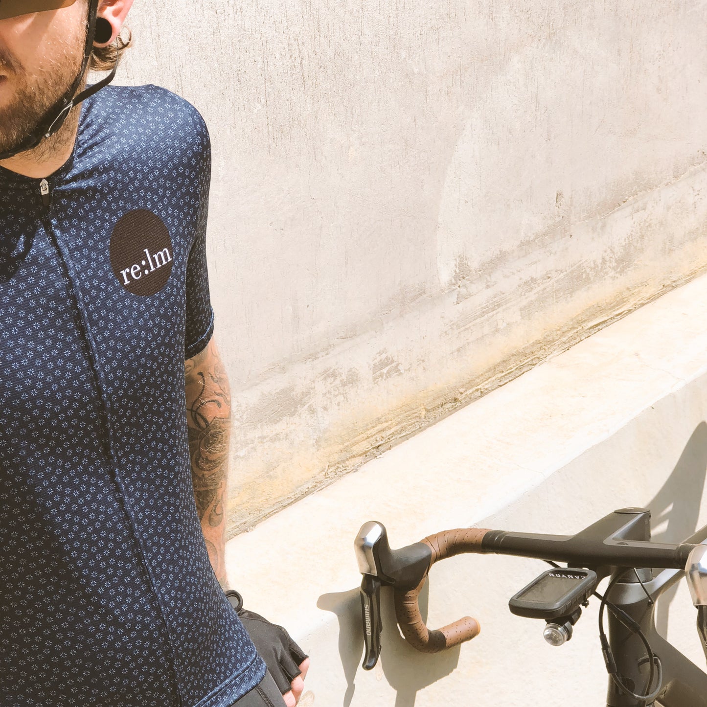 Man wearing Relm Cycling jersey in bloom