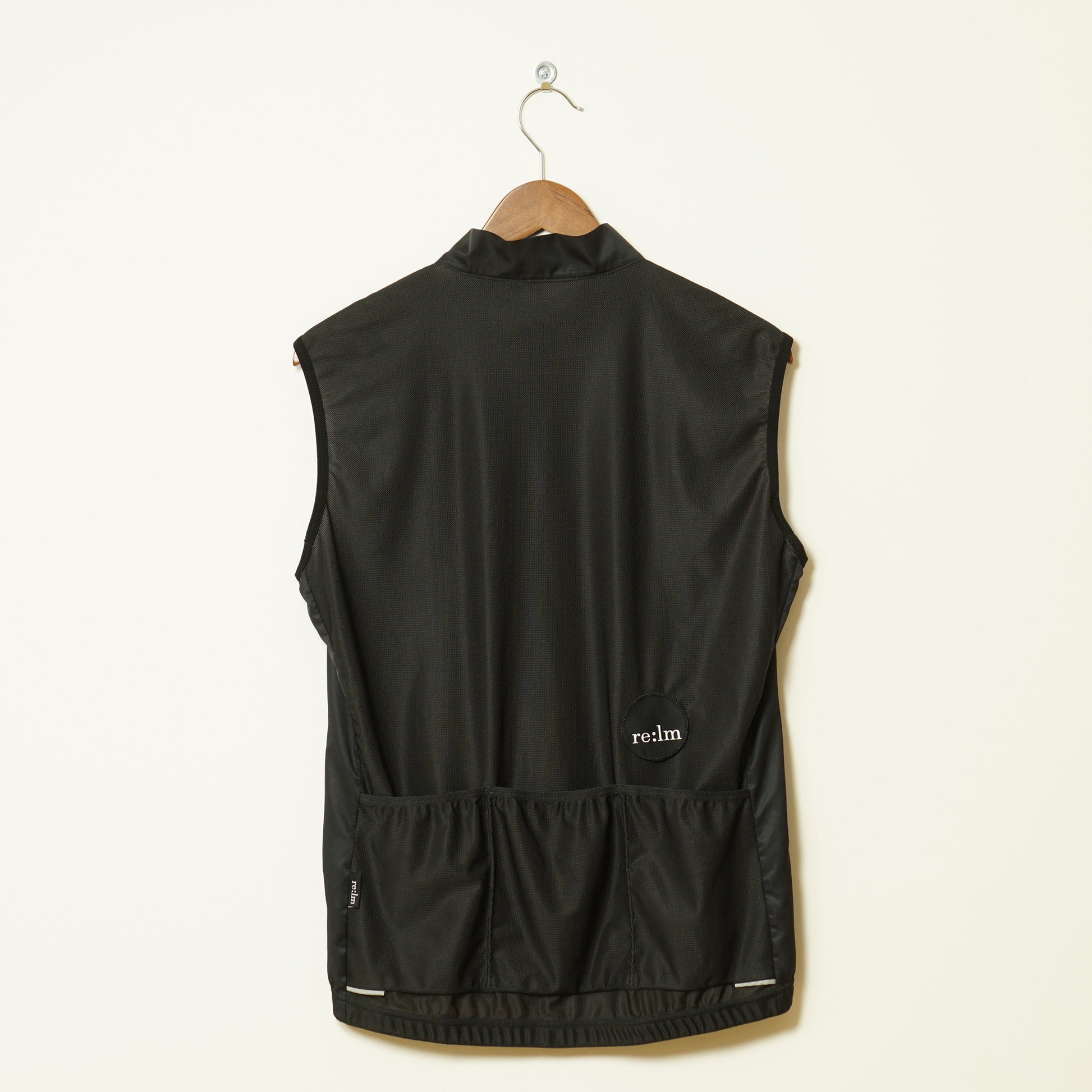 Back of women's black patch Relm Cycling gilet