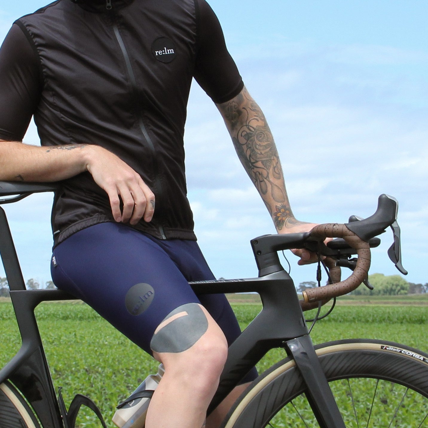 Man wearing black Relm Cycling Patch Gilet