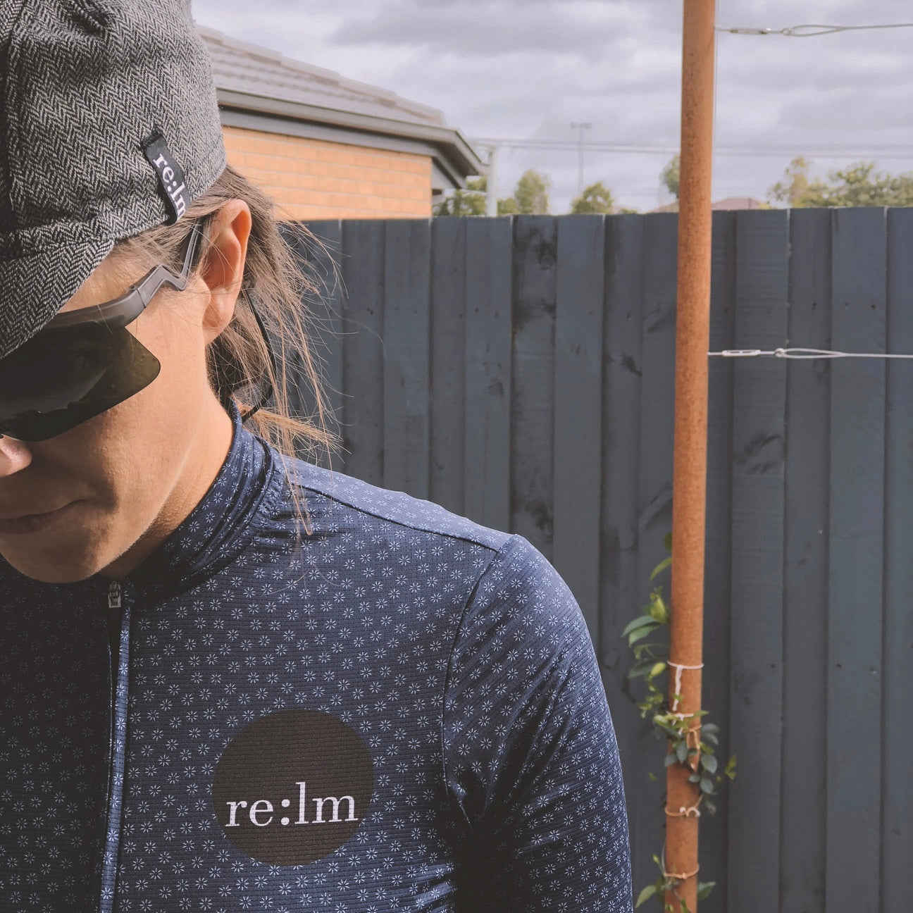 Women wearing Evolve Relm Cycling jersey in bloom